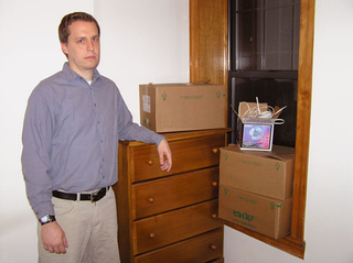 Ward Buell stands beside the dresser that sparked Estes’ memory.